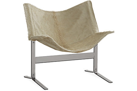 tan lounge chair on stainless steel frame