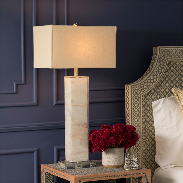 lamp shown styled on nightstand in bedroom