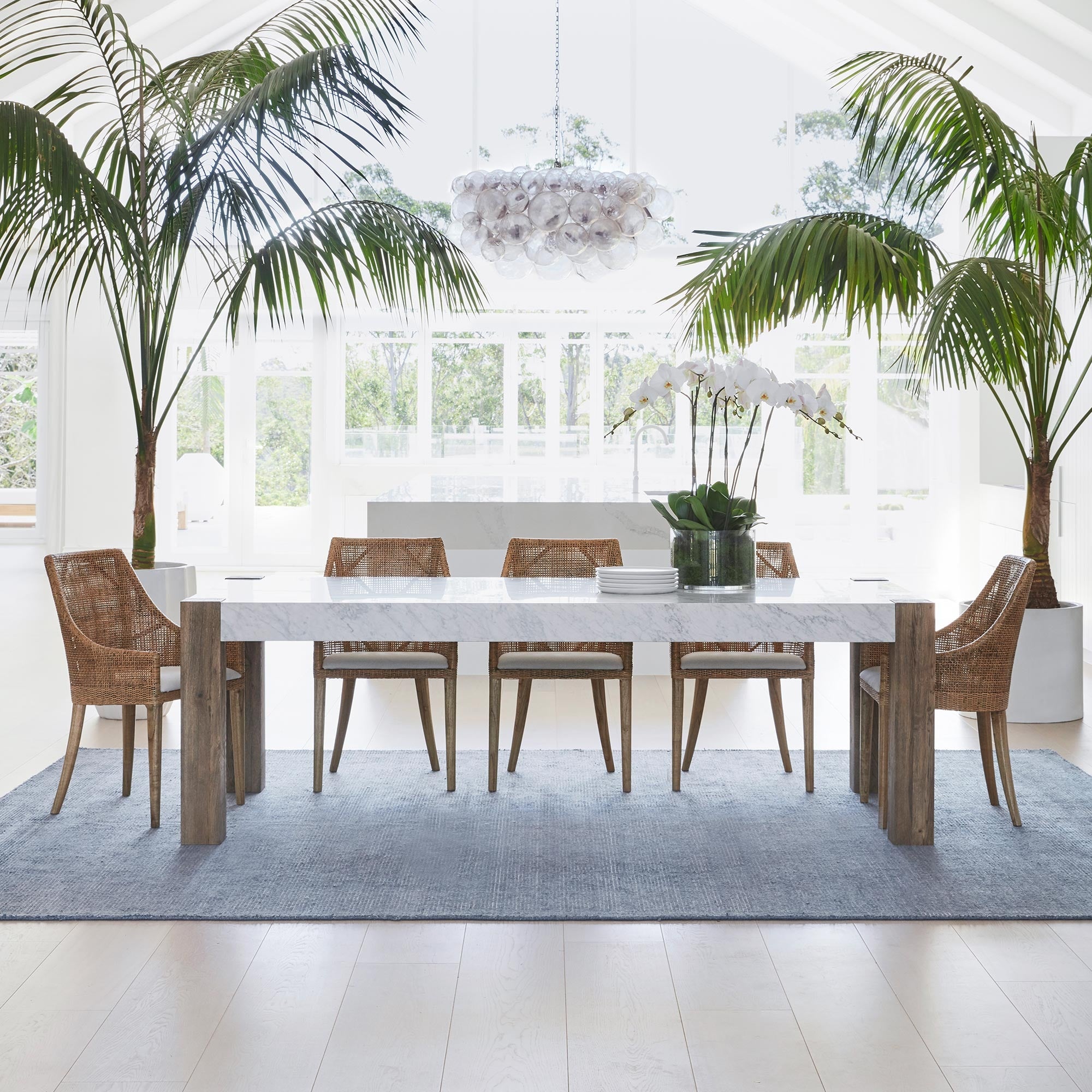 chandelier hanging above dining room table on terrace