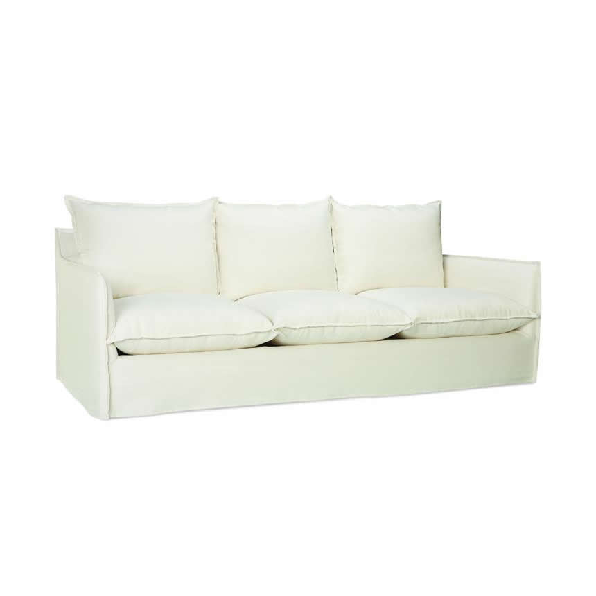 angle view of sofa with three seating cushions in white fabric option