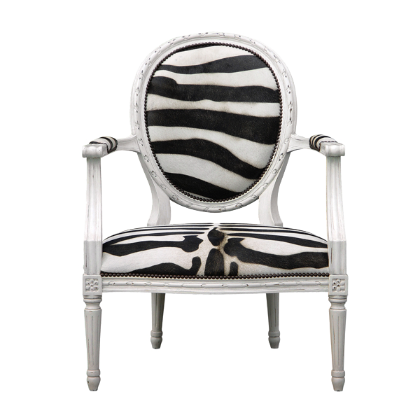 white wooden armchair with zebra-pattern fabric