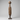 Antique Tuareg carved wood tent peg with domed head and floral carving, mounted on a display stand