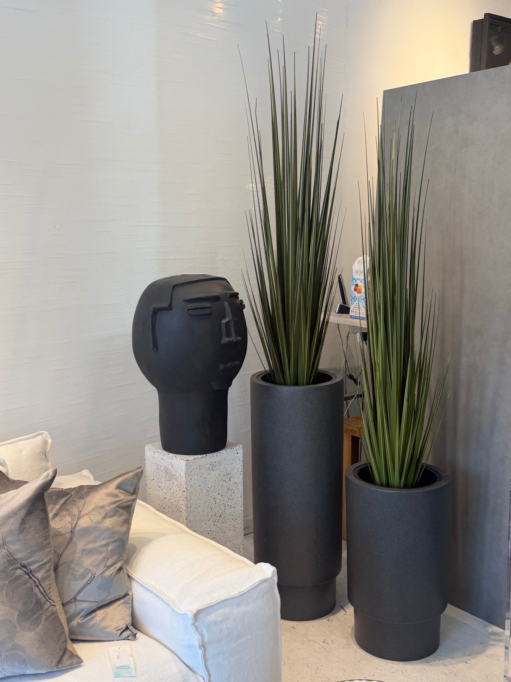 modern round fiberstone planter in dark gray stone finish