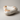 Hand-carved Moroccan Atlas onyx doughnut bowl featuring creamy white stone with warm honey mineral veining and a polished sculptural finish.
