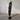 Organic teak root ribbon sculpture in black with flowing abstract form on metal base