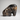 Petrified wood elephant sculpture in amber and black tones with mineral veining, large size