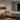Modern bedroom with a bed, nightstand, and wall art.