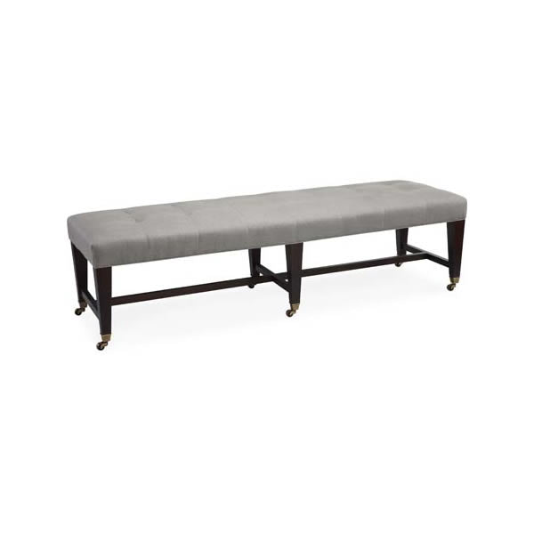 oversized ottoman with tufted grey fabric and black base with wheels