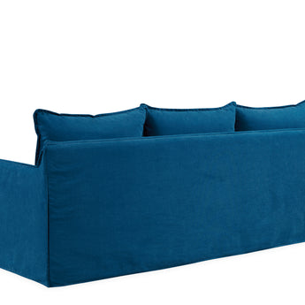 back view of sofa with three seating cushions in blue fabric option