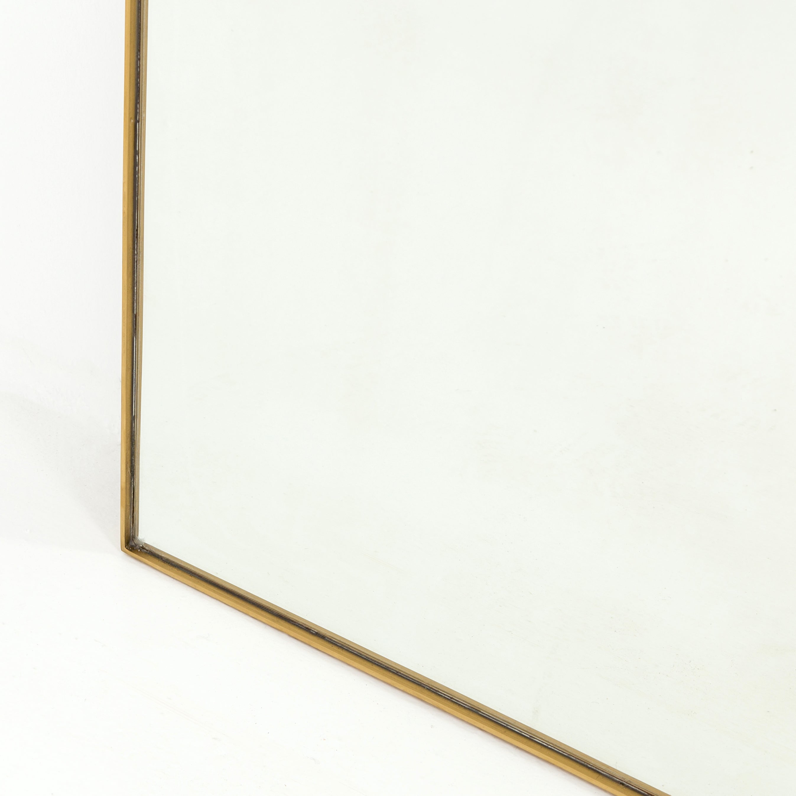 closeup of bottom of polished brass frame