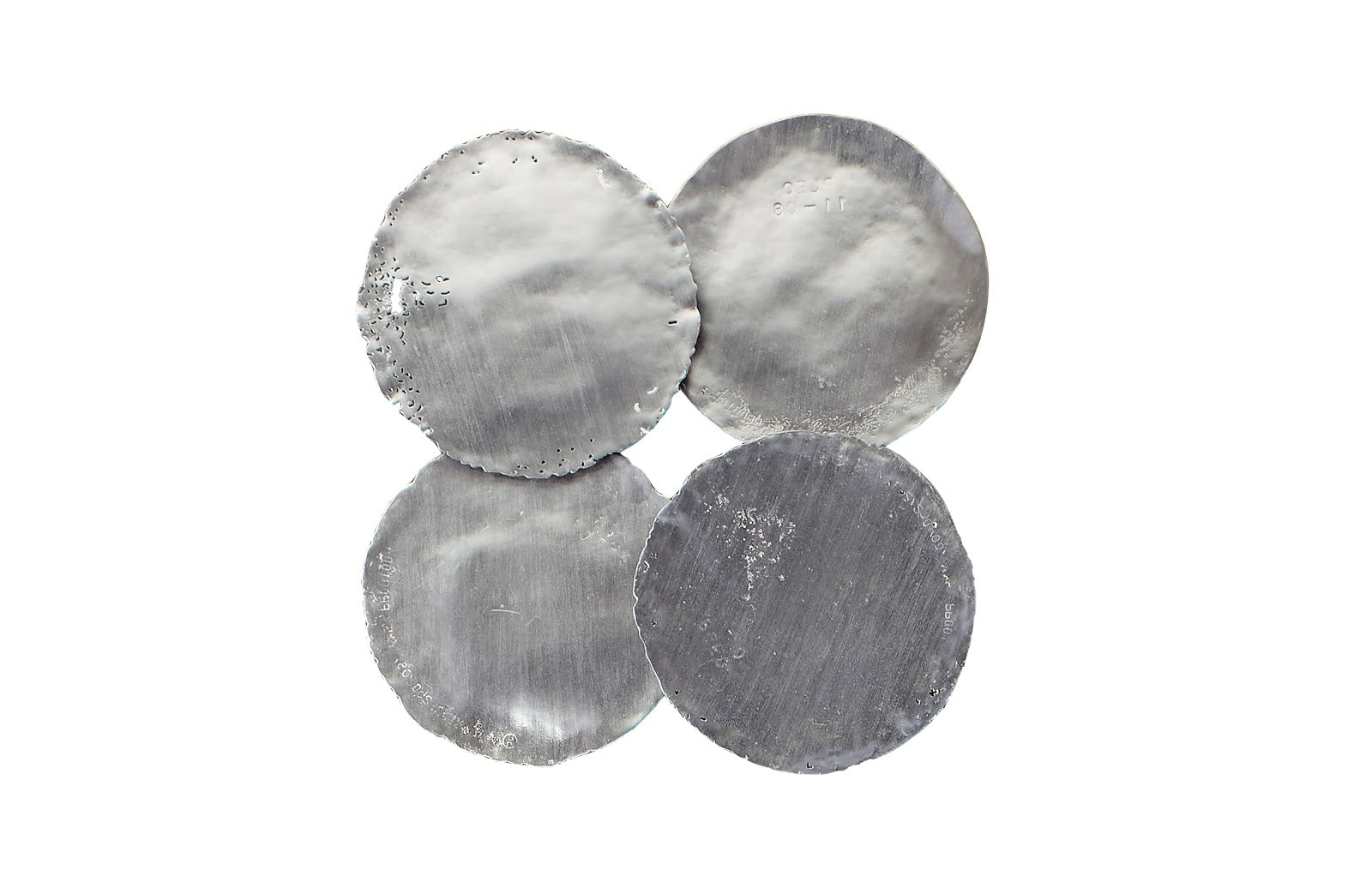 four circular pieces of wall art finished in silver leaf