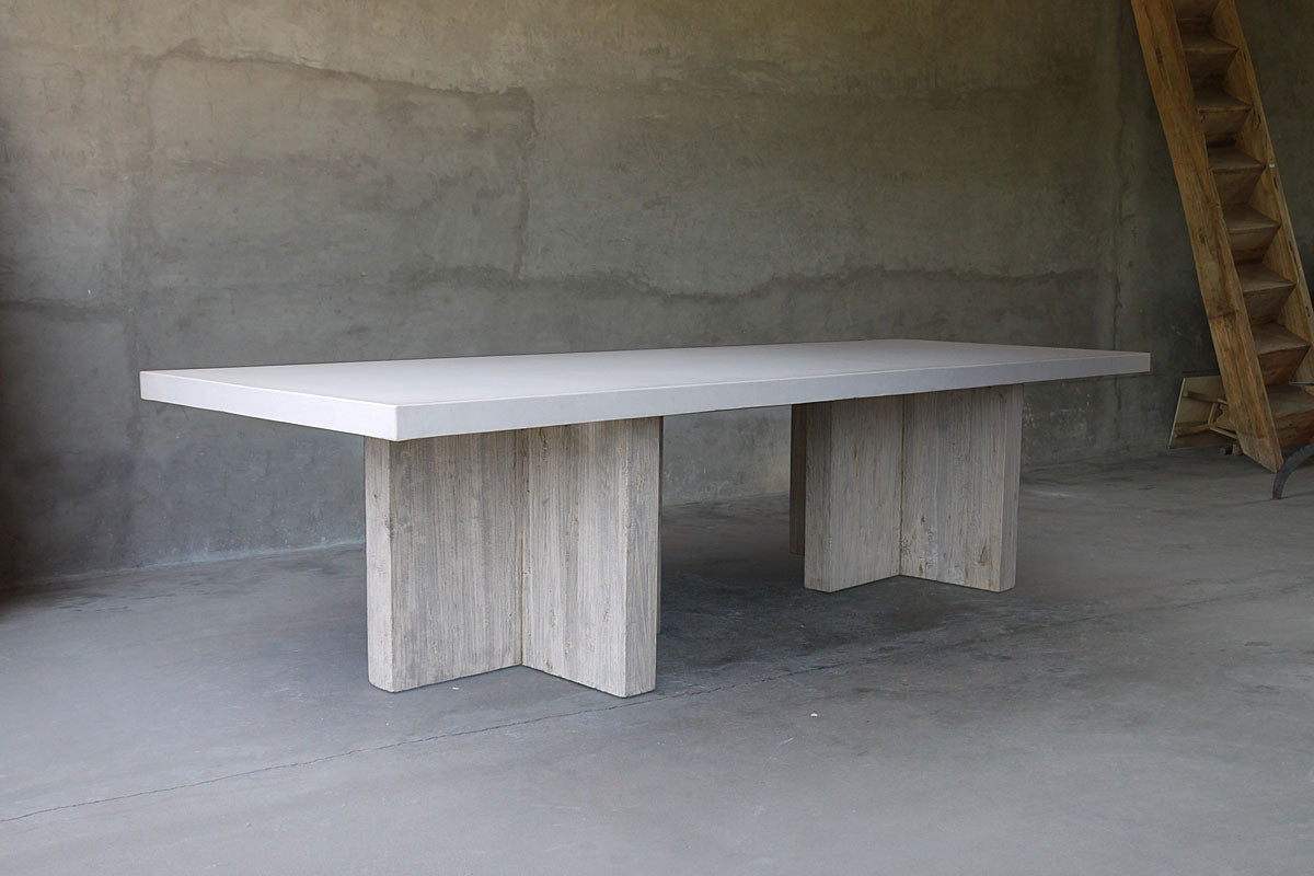 rectangular concrete table with wooden t-shaped bases