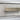closeup of hair-on-hide texture and brushed metal drawer handle
