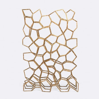 geometric patterned brass room divider