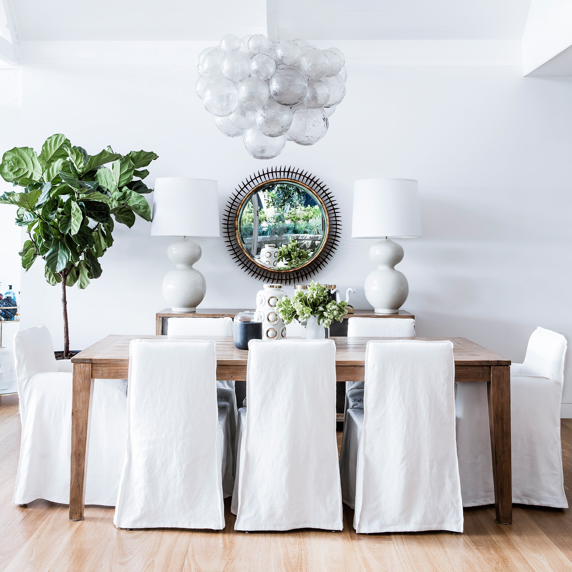 chandelier hanging above dining room table