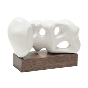 abstract white sculpture on dark wooden base