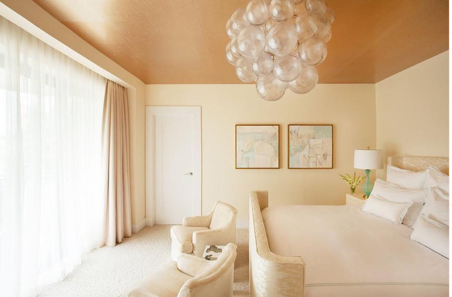 chandelier hanging in neutral tone bedroom