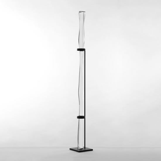 vertical glass rod on black display frame
