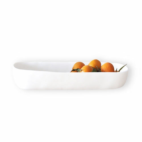 white vessel with citrus fruit