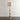 multicolor floor lamp with a base made from stacked discs of natural horn